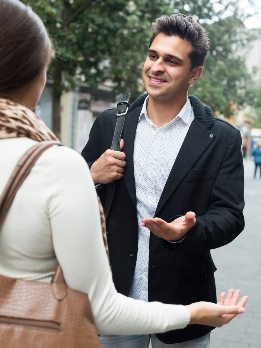 Girl flirting with guy at the street